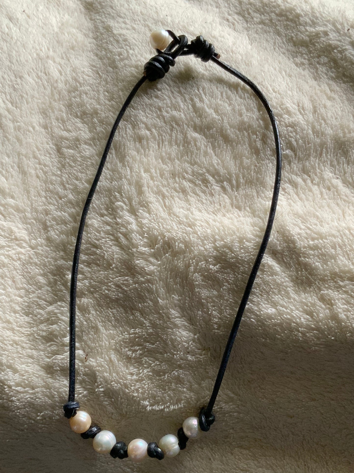Black leather cord necklace with pearls